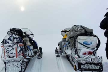 Snowmobile expeditions to Barents Sea on Kola Peninsula. Northwest Russia