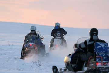 Snowmobile expeditions to Barents Sea on Kola Peninsula. Northwest Russia